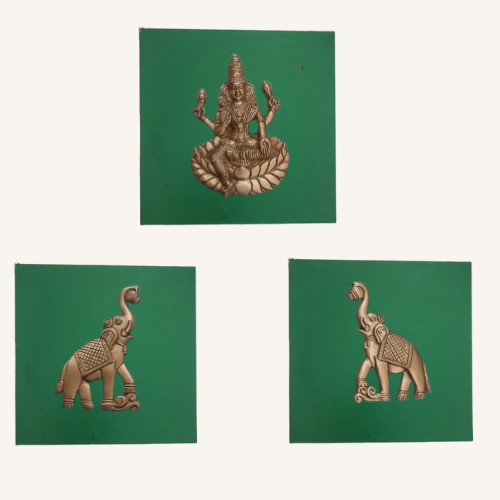 Three decorative items on green freme: a deity figure, an elephant, and another elephant.