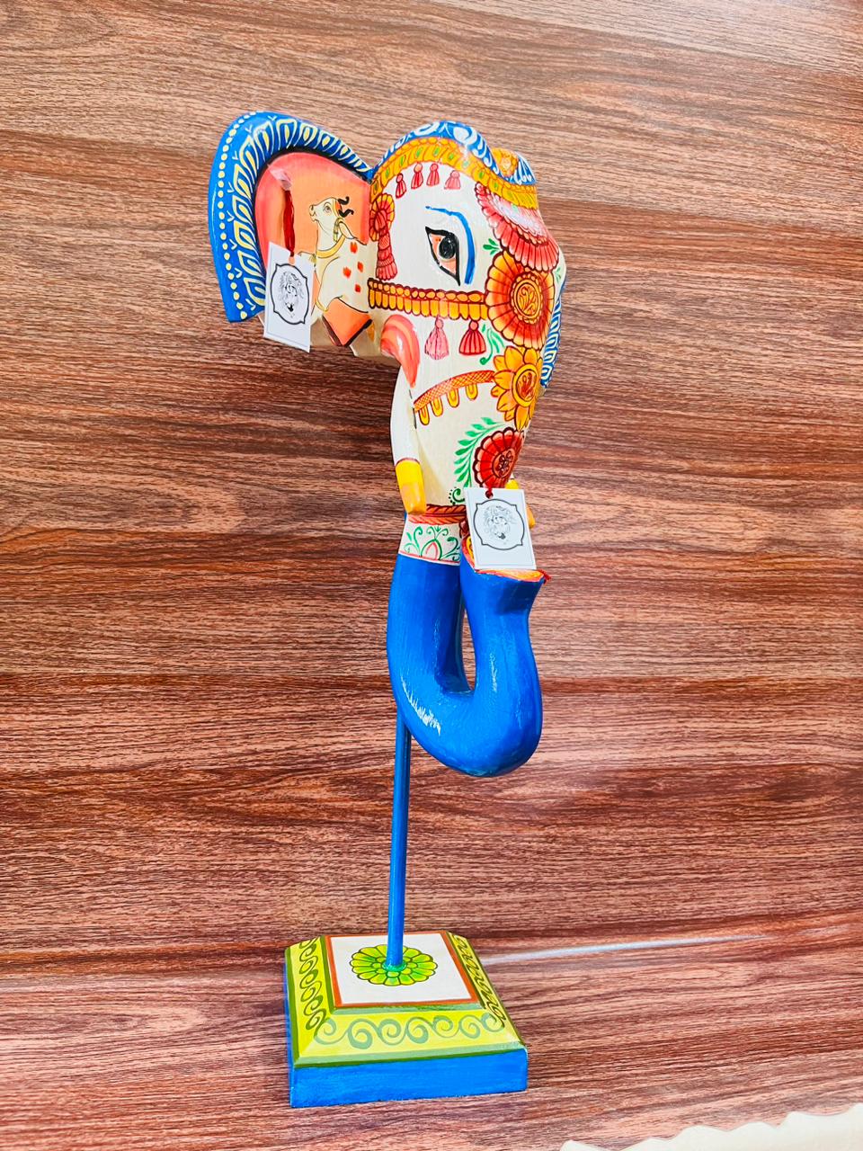 Handpainted wooden elephant face with a detachable stand in Blue